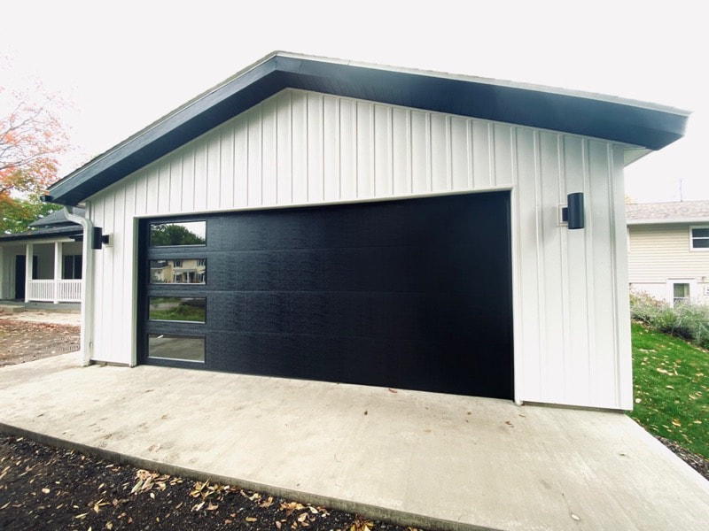 Wayne Dalton Garage Door Model 8300 in Black with Contemporary Panels and Vertical Clear Lites.  Installed by Augusta Garage Door in Avon, MN.