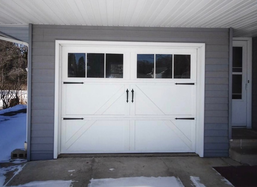 Wayne Dalton Carriage House Garage Door in White with Decorative Hardware.  Installed by Augusta Garage Door in St. Augusta, MN.