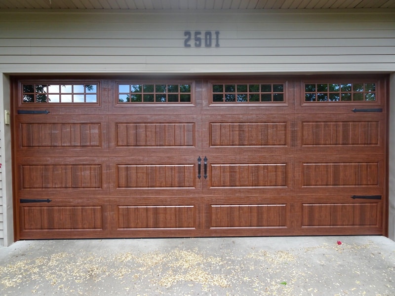 Amarr Hillcrest 3000 Garage Door in Walnut with Long Panel Bead Board Panels and Stockton Windows.  Installed by Augusta Garage Door in St. Cloud, MN.