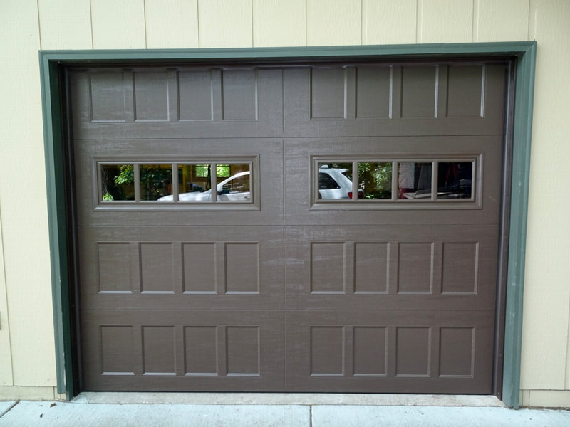 Amarr Hillcrest 3000 in Dark Brown with Recessed Panels and Thames Windows.  Installed by Augusta Garage Door in Kimball, MN.